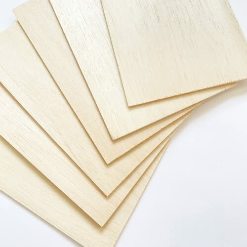 Stack of balsa wood sheets on a white background