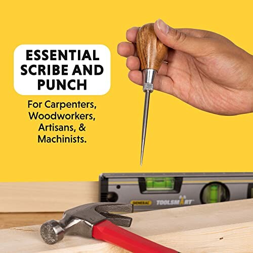 Hand holding a scribe and punch tool for carpenters and woodworkers.