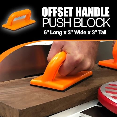 Orange offset handle push block in use on woodworking tool.