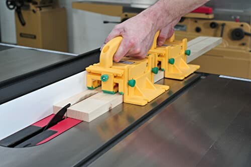 Person using a push block on a table saw for safety