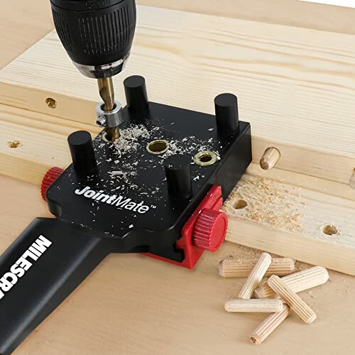 Drill using doweling jig on wooden board with wood plugs.