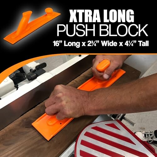 Person using an orange extra long push block on a wooden surface.